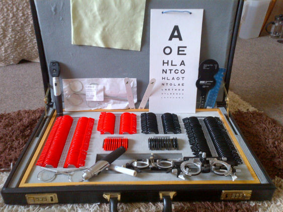 TRIAL LENS SET IN BLACK LEATHER BRIEFCASE AND OTHE